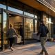 Workers prepare a modern dispensary storefront for opening